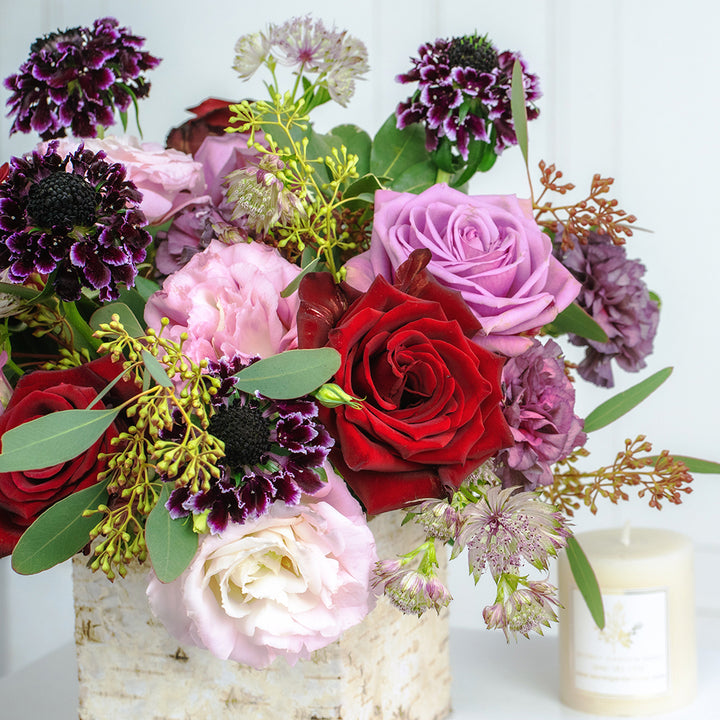 Bundle of Pink Lisianthus, Cool Water Roses, Freedom Roses, Scabiosa, and Carnations with Pittosporums and Seeded Eucalyptus greeneries.