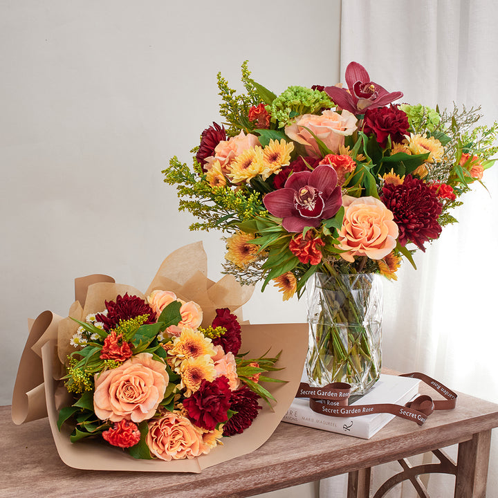 Bouquet of Green Hydrangeas, Phoenix Roses, Cymbidiums, Celosia, Burgundy Mums, Pompoms, Solidago, and Red Carnations with Lemon Leave greeneries.