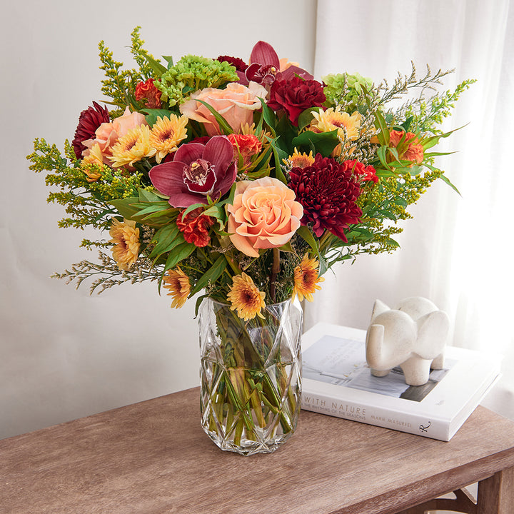 Bouquet of Green Hydrangeas, Phoenix Roses, Cymbidiums, Celosia, Burgundy Mums, Pompoms, Solidago, and Red Carnations with Lemon Leave greeneries.